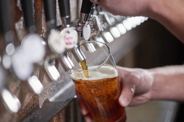 Craft beer being poured.