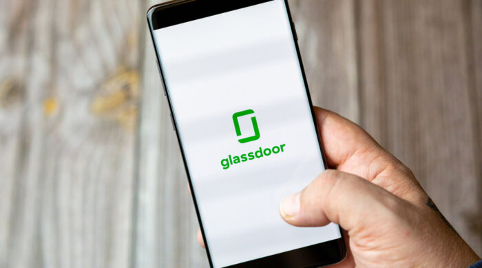 Glassdoor logo on a black smartphone.